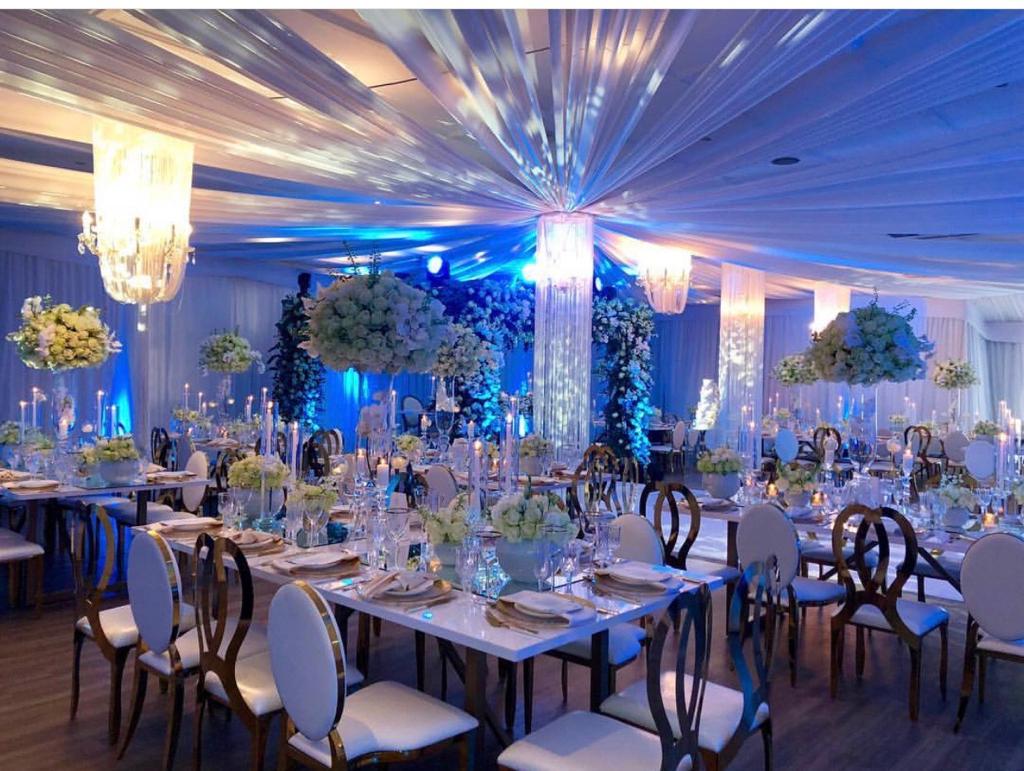Stylishly decorated venue with tables and floral arrangements.