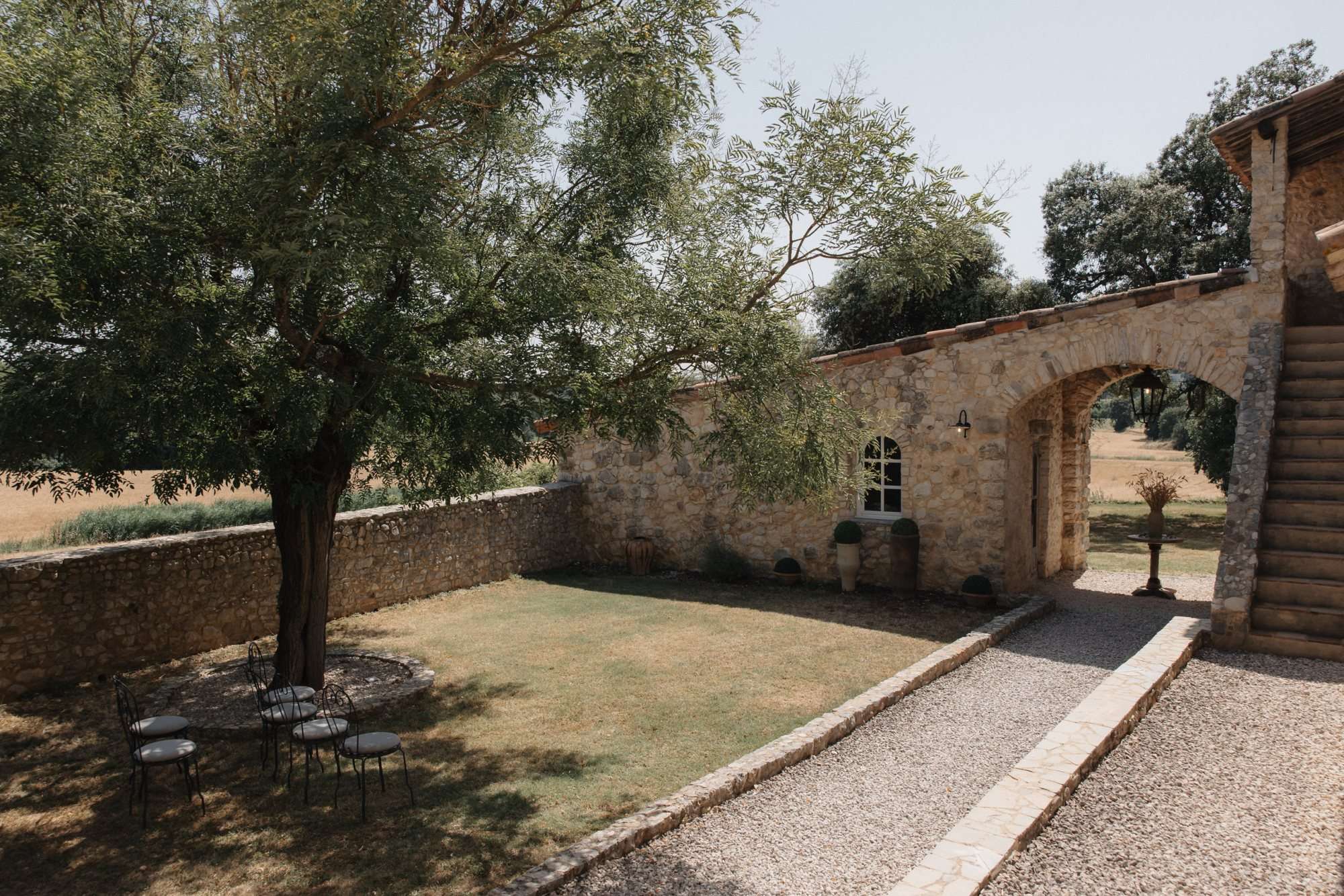 Outdoor garden venue with cozy seating and stone architecture