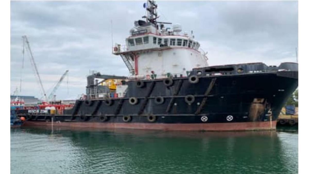 Large industrial vessel docked at the port.
