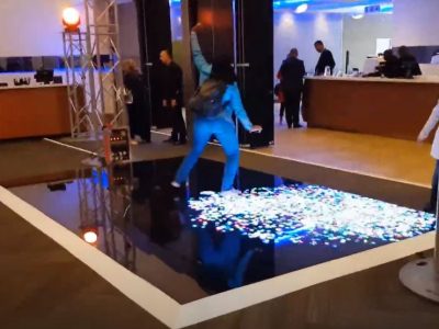 Guest interacting with an illuminated dance floor
