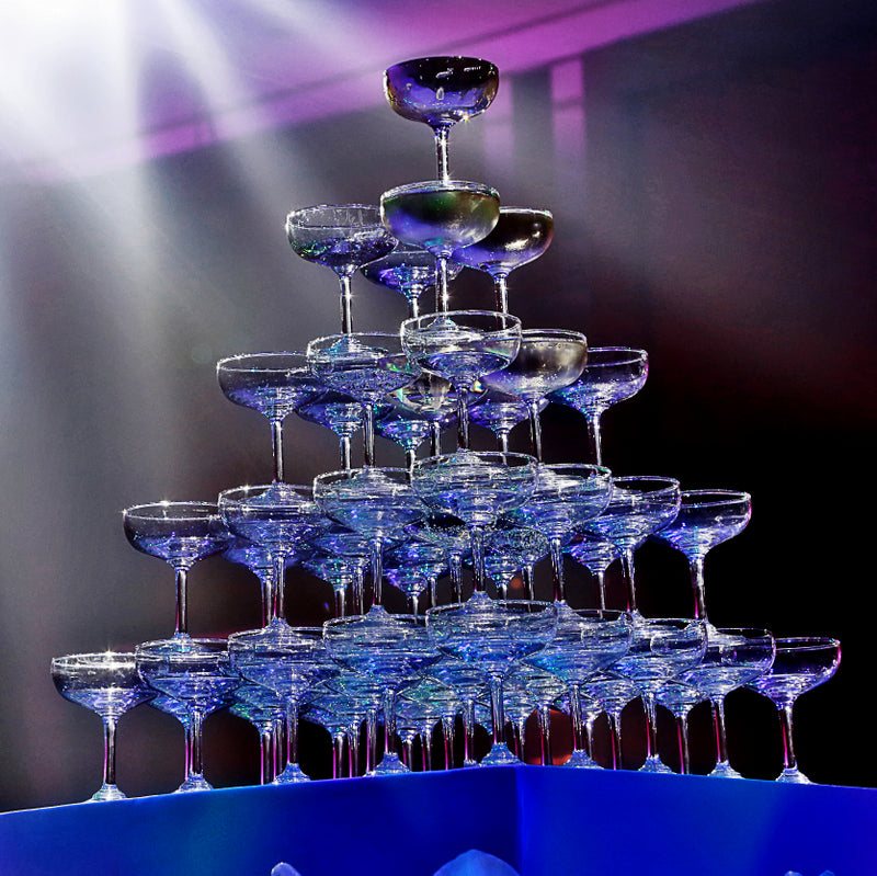 Champagne glasses arranged in a decorative tower