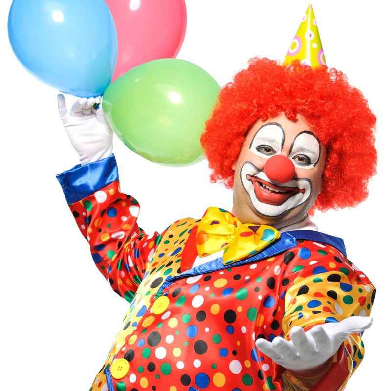 Clown in polka dot costume holding balloons