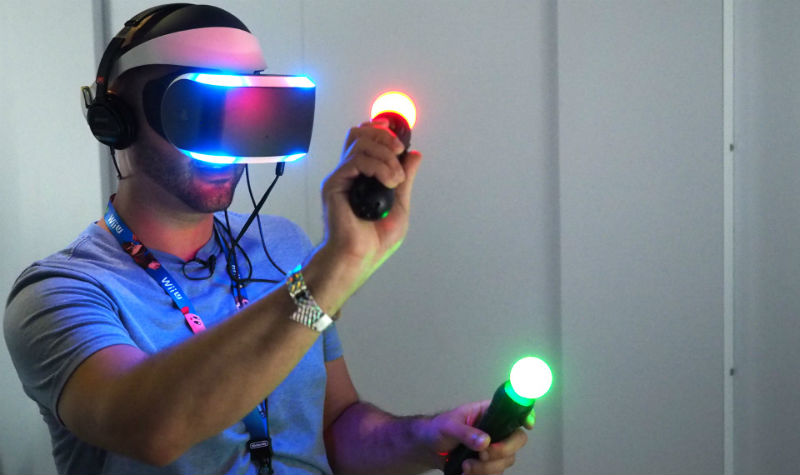 Man using virtual reality headset and controllers