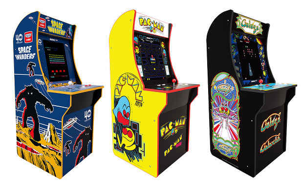 Three arcade game machines: Space Invaders, Pac-Man, Galactic Warriors.