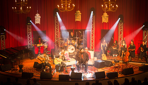 Stage setup with musicians, instruments, and lighting effects