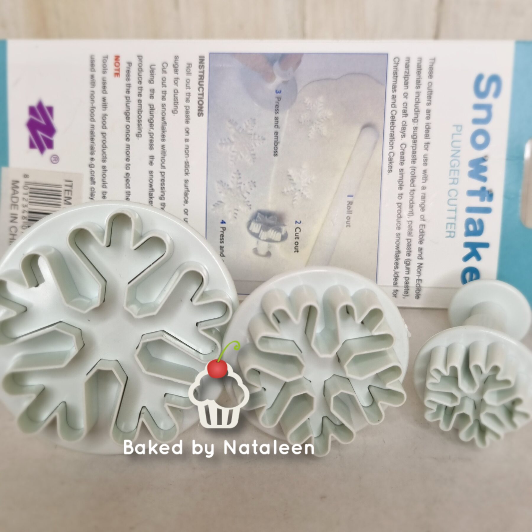 Three snowflake plunger cutters and packaging