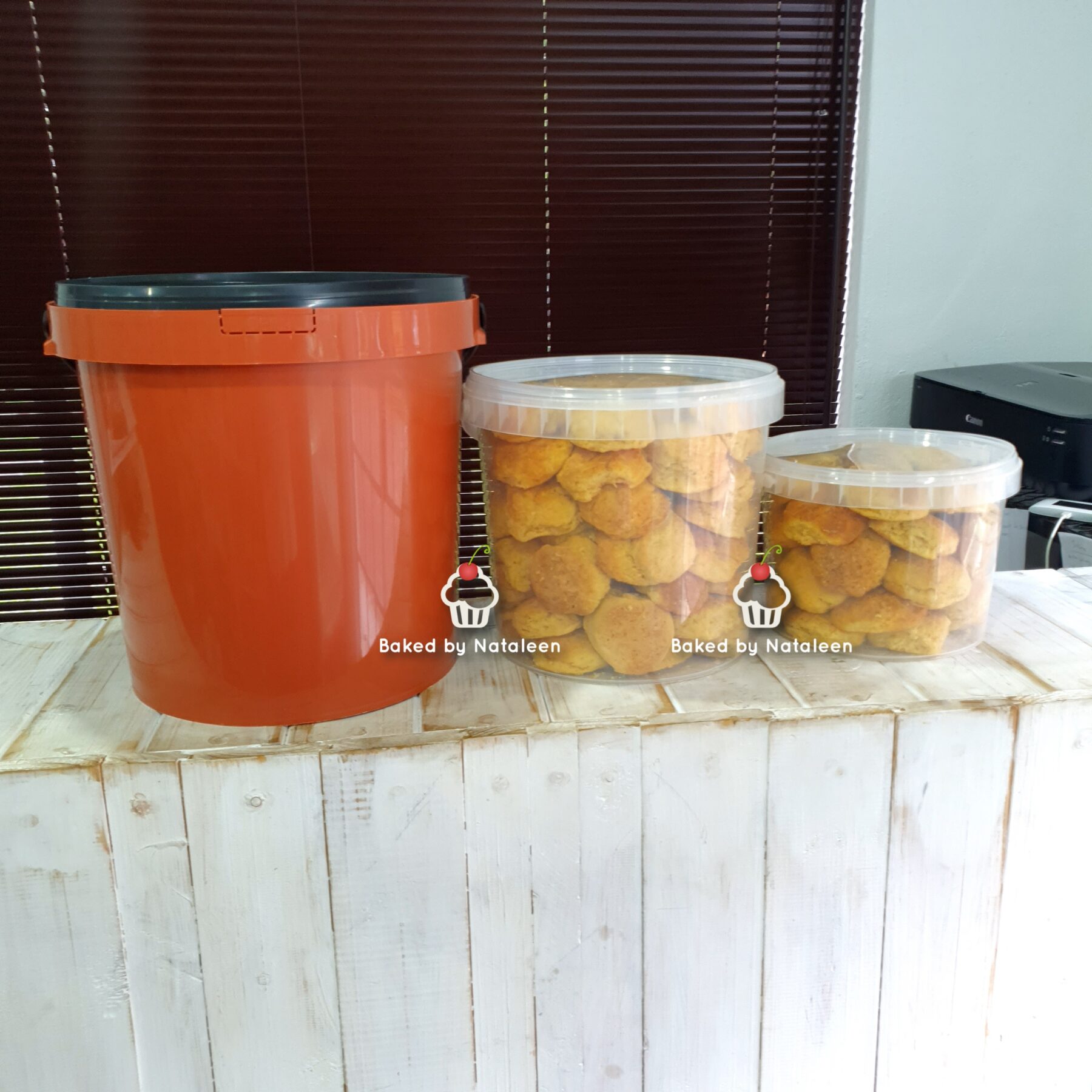 Three containers for storing cookies.