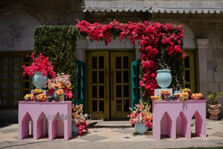 Colorful floral decorations at an event venue entrance.