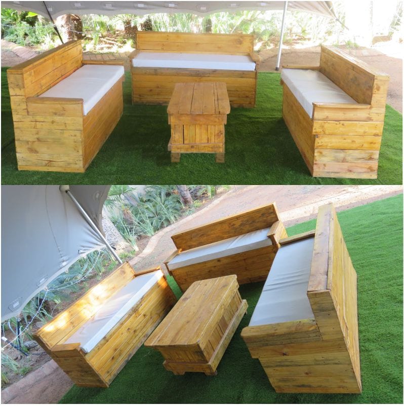 Rustic wooden lounge set with sofas and table on grass