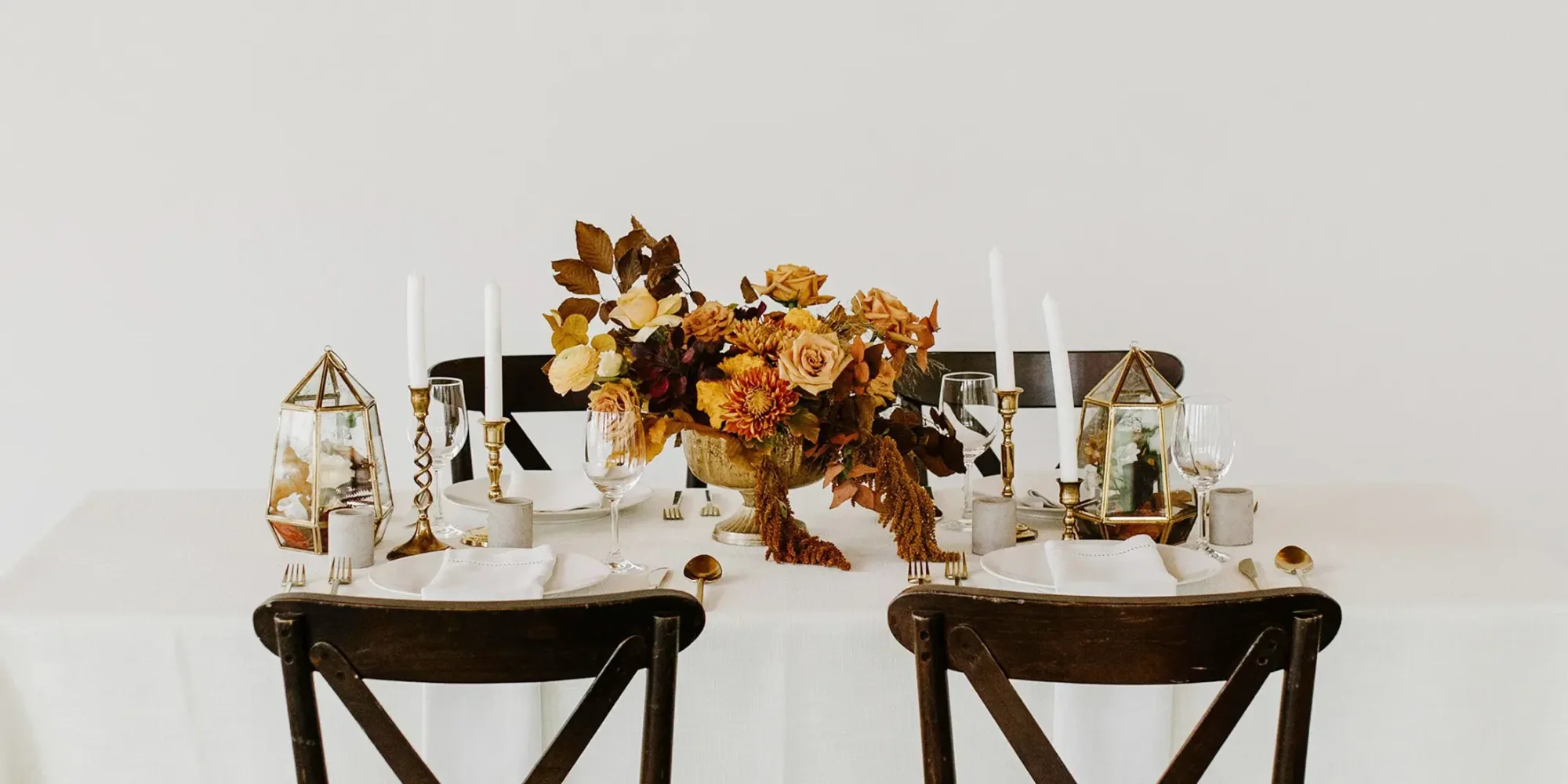 Elegant table setting with floral centerpiece and candles