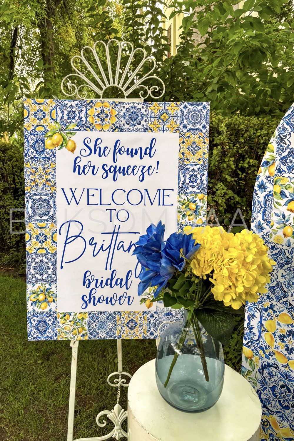 Welcome sign for a bridal shower featuring a floral design.