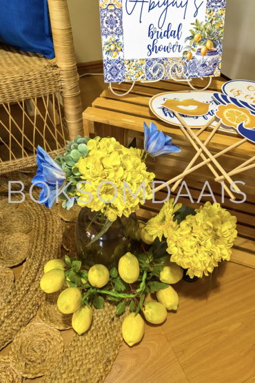 Yellow flowers and lemons arranged for a bridal shower