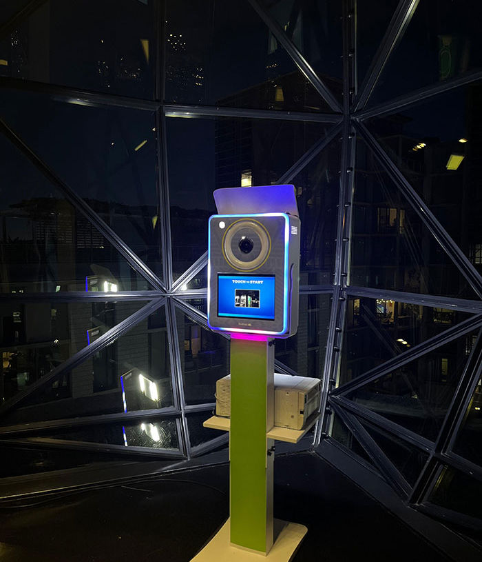 Selfie Pod setup with colorful lights at night
