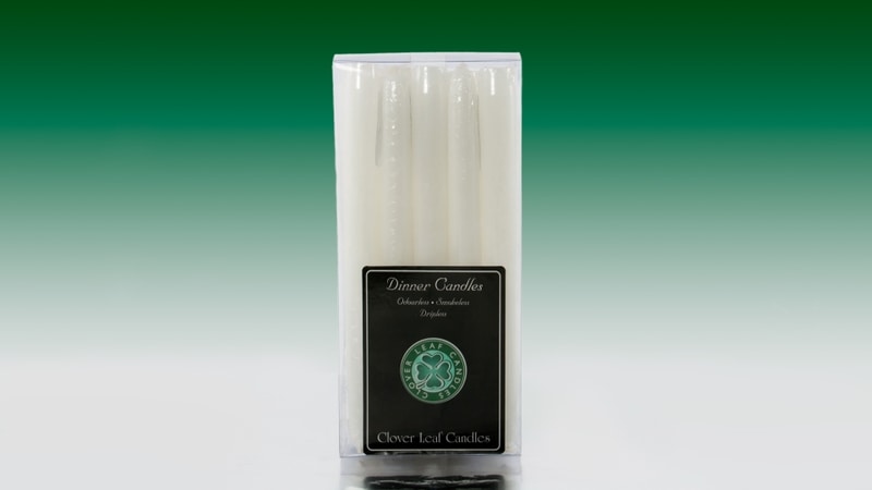 White dinner candles in packaging