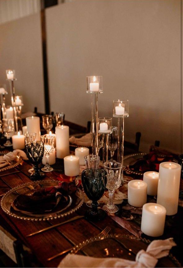 Table set with various candles and glassware