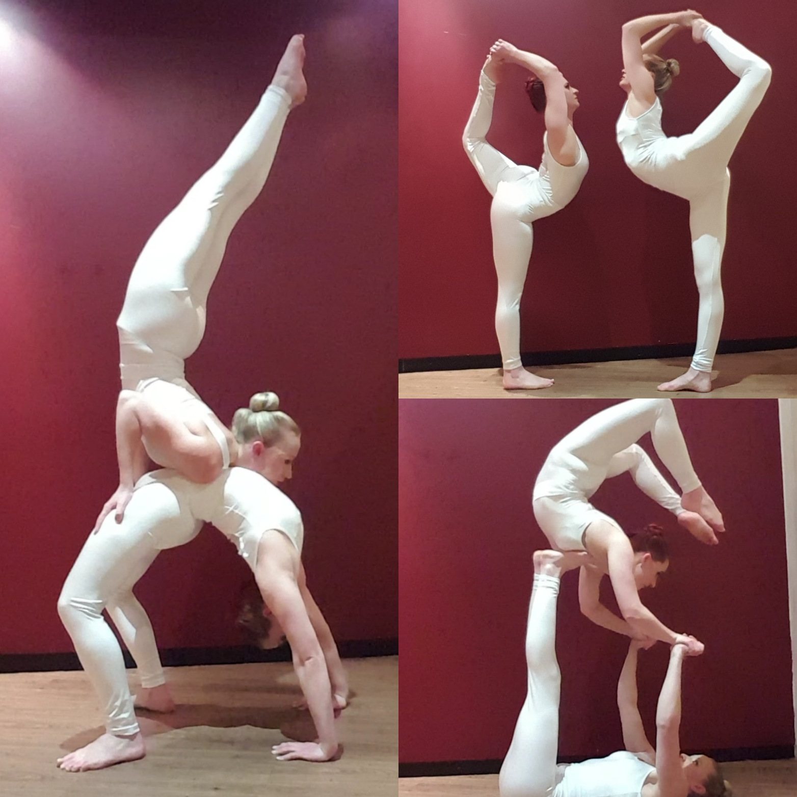 Two acrobats in white outfits performing poses