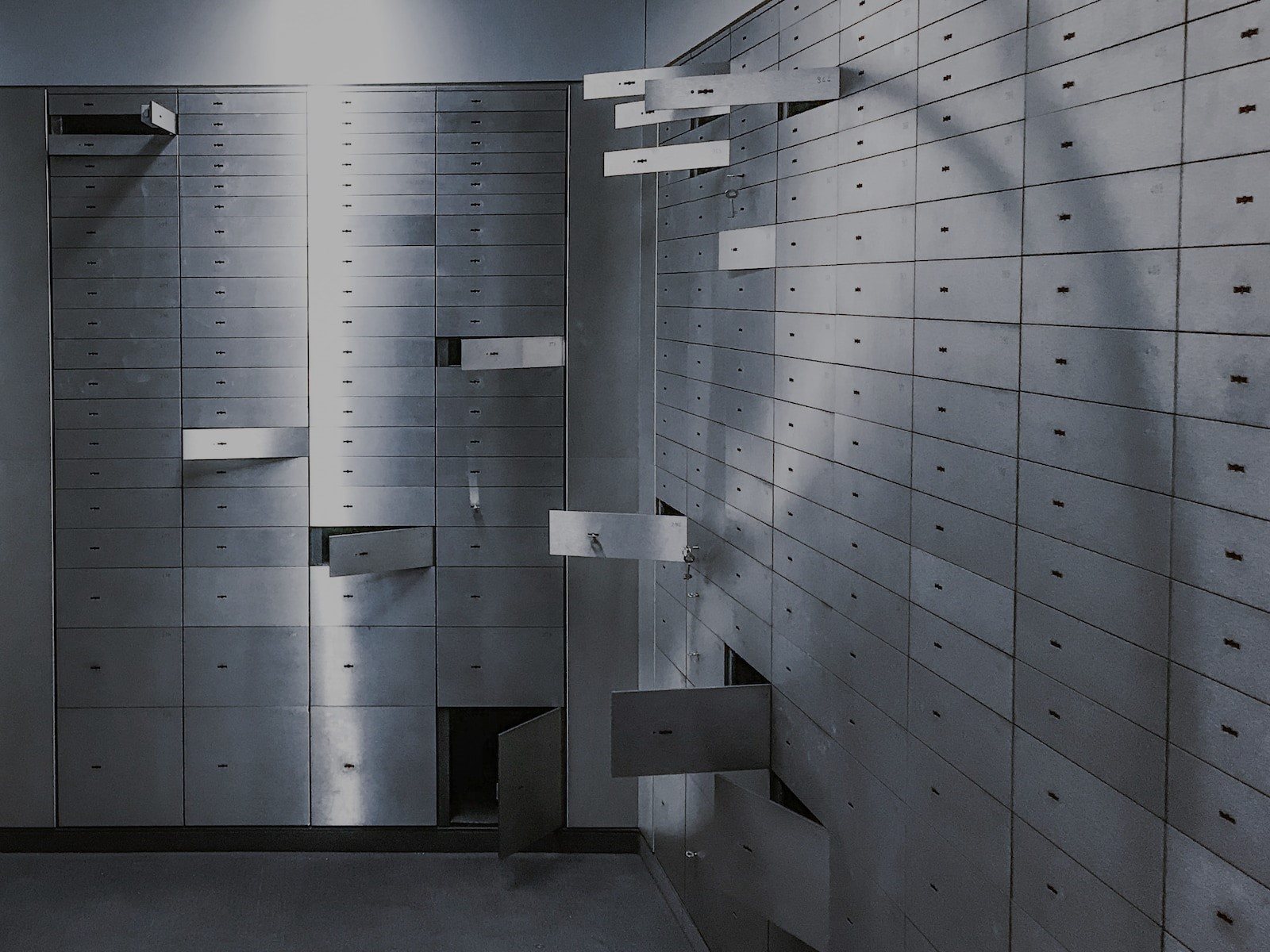 Interior of a vault escape room with open drawers