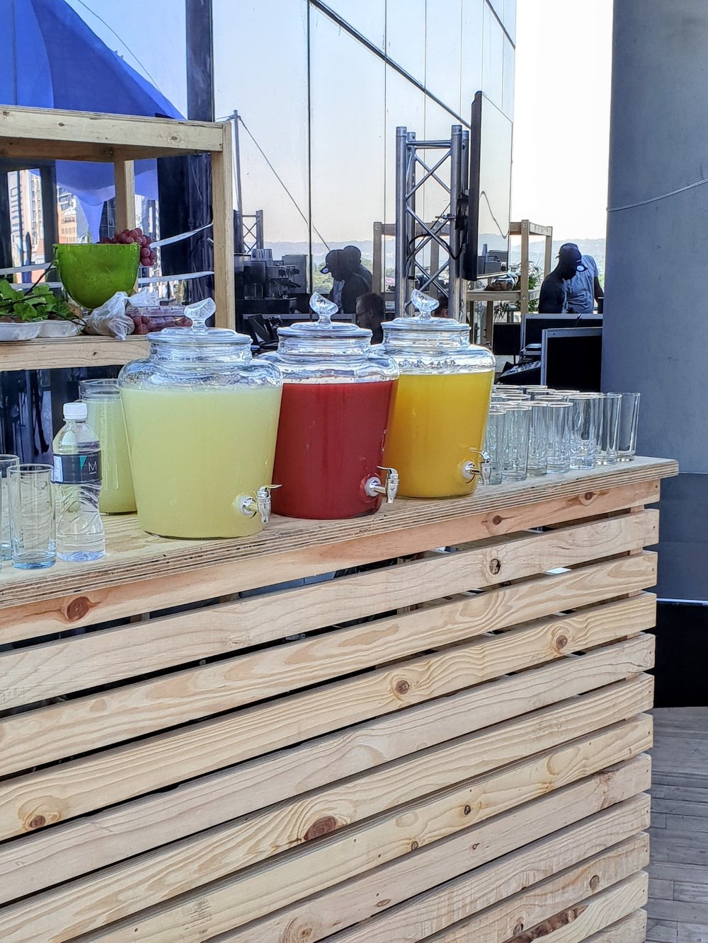 Beverage station with dispensers of drinks on a wooden counter