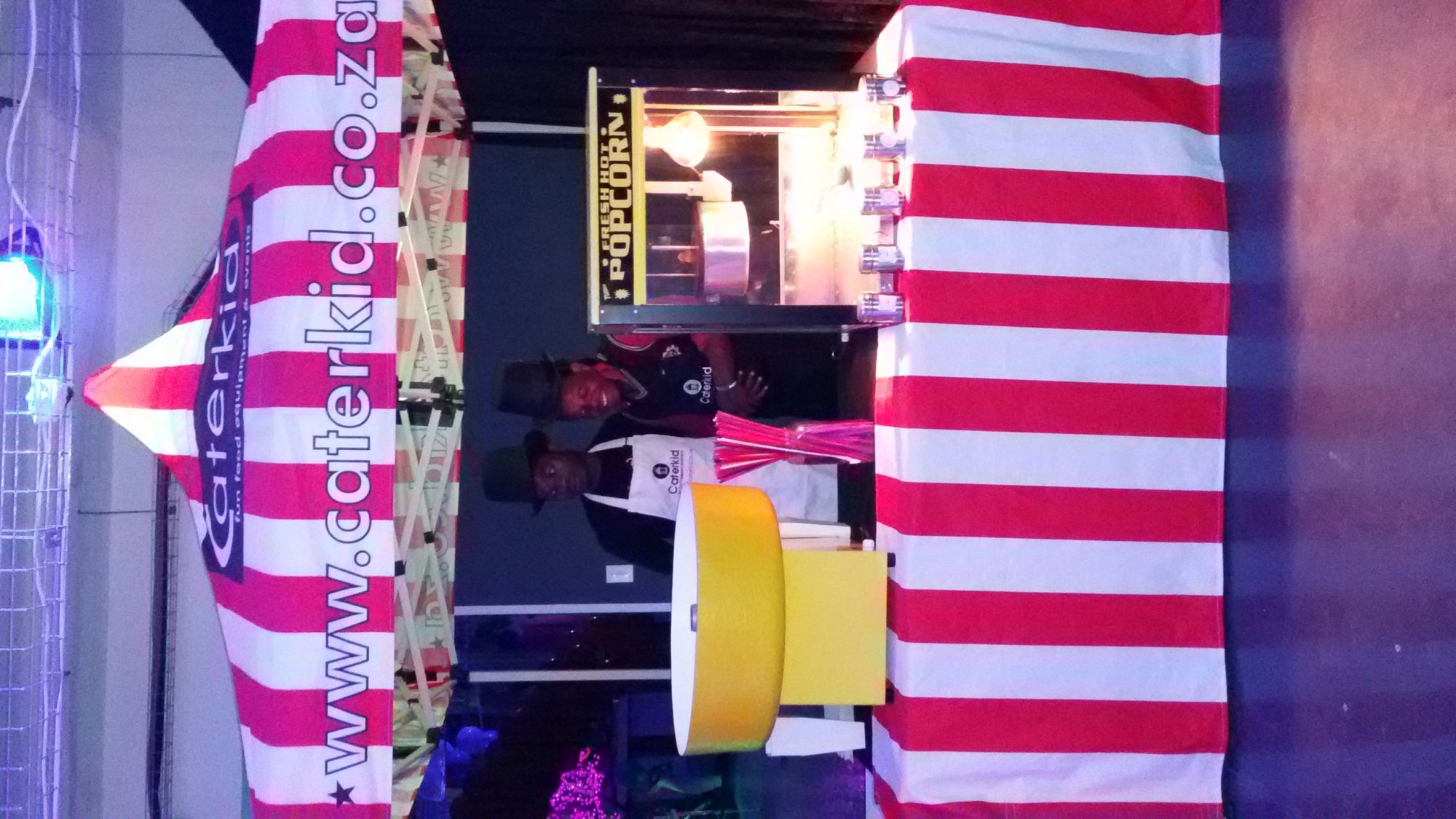 Popcorn machine with striped tent setup by Caterkid
