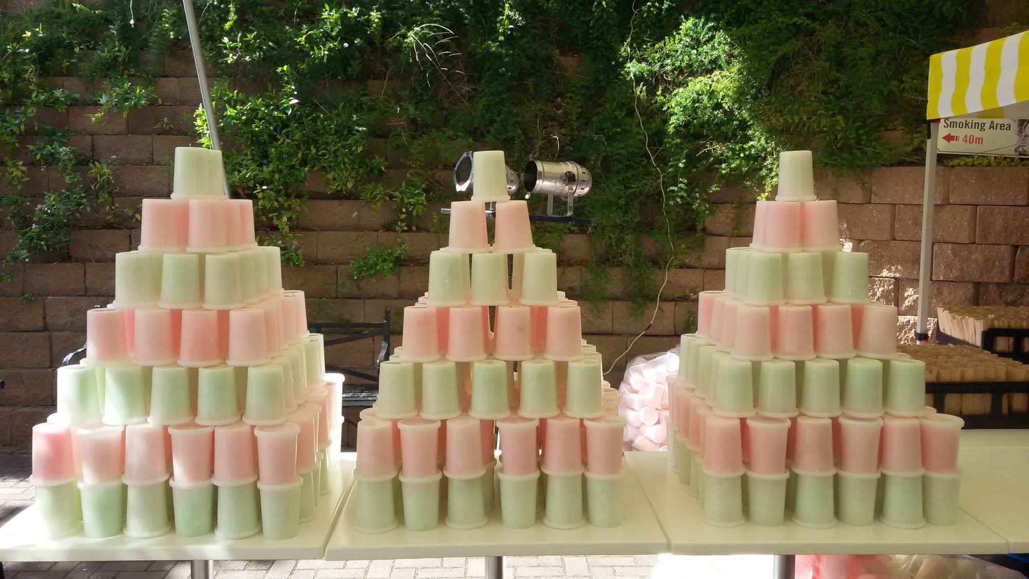 Pyramid display of frozen treat cups in pink and green