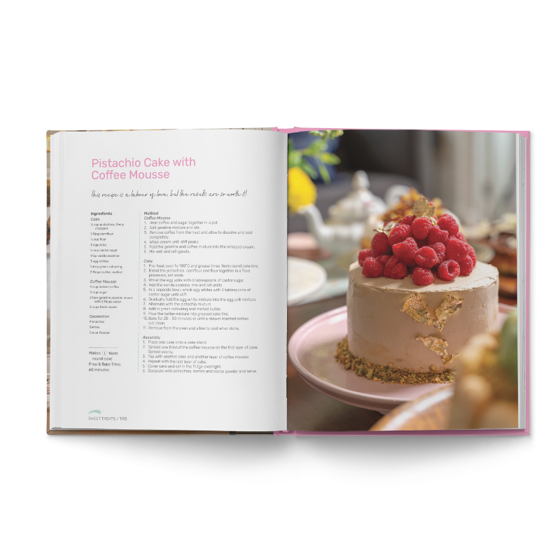 Open recipe book displaying pistachio cake with coffee mousse