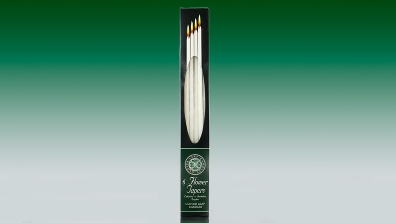 Pack of six flower taper candles in a box