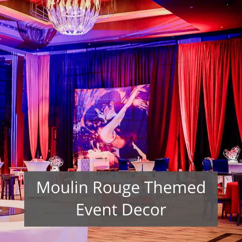 Moulin Rouge themed event decor with red drapes and backdrop