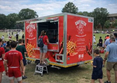 Colorful mobile food trailer at a sports event