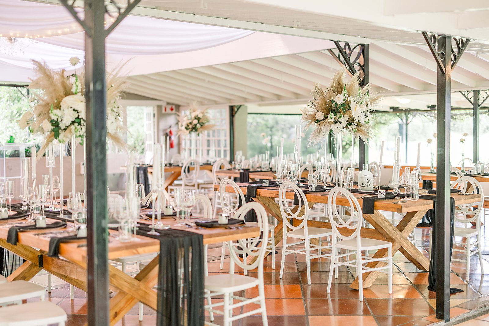 Stylishly arranged dining tables with floral centerpieces and decor