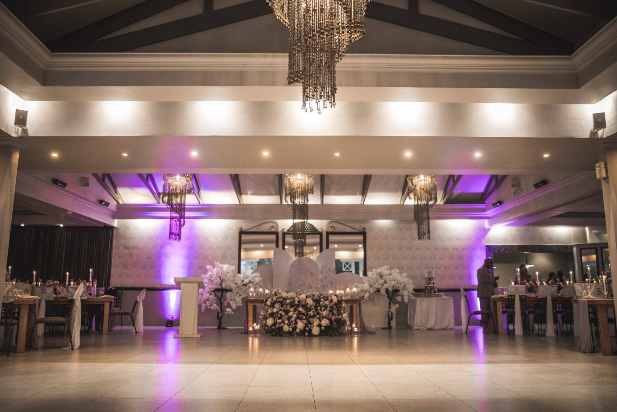 Stylishly decorated event space with floral arrangements