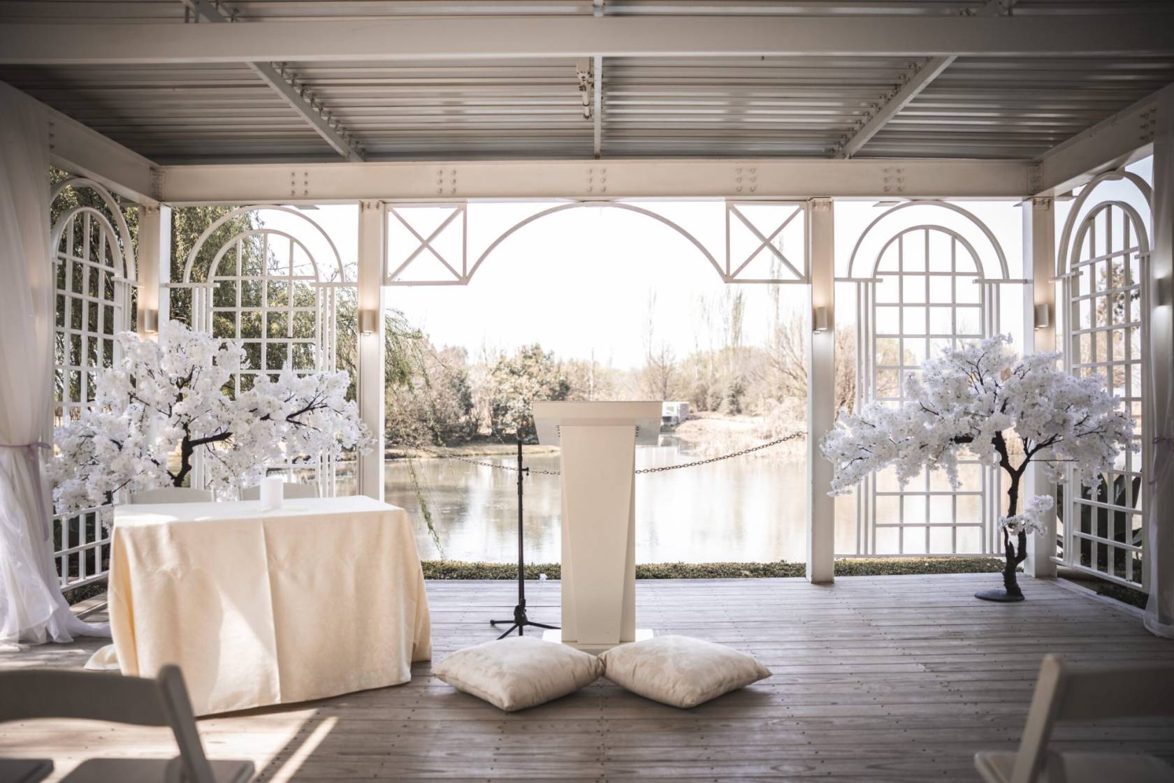 Outdoor wedding setup with a table and floral trees