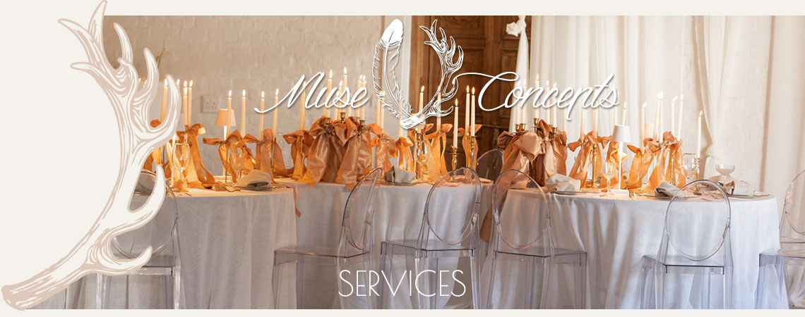Elegant table setup with white tablecloths and candles