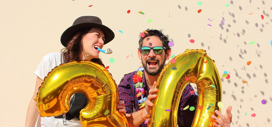 Gold number balloons with confetti in a festive setting