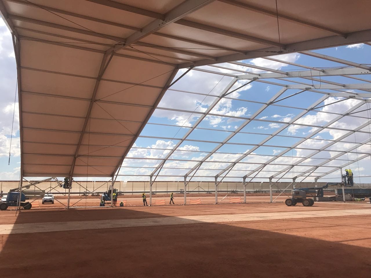 Large marquee being assembled with team at work