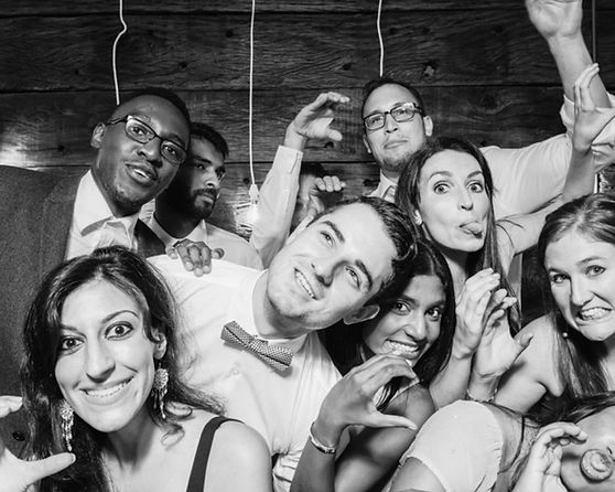 Group of friends posing and smiling at an event