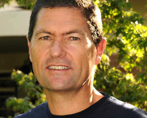 Smiling man outdoors in casual clothing