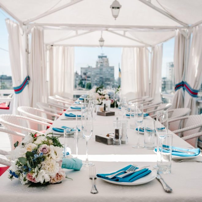 Table setting with flowers and tableware in a bright venue