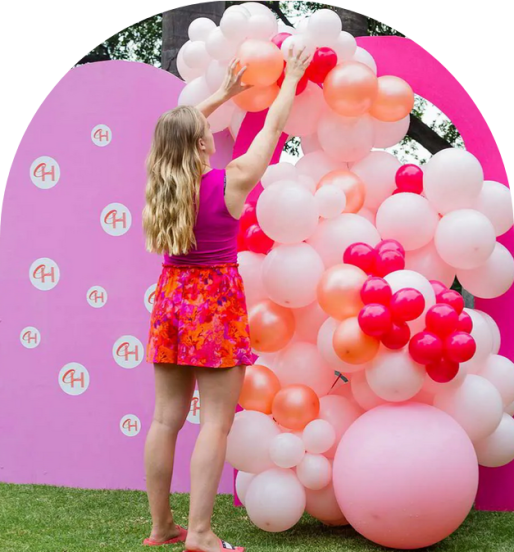 Colorful balloon installation with pink and red colors