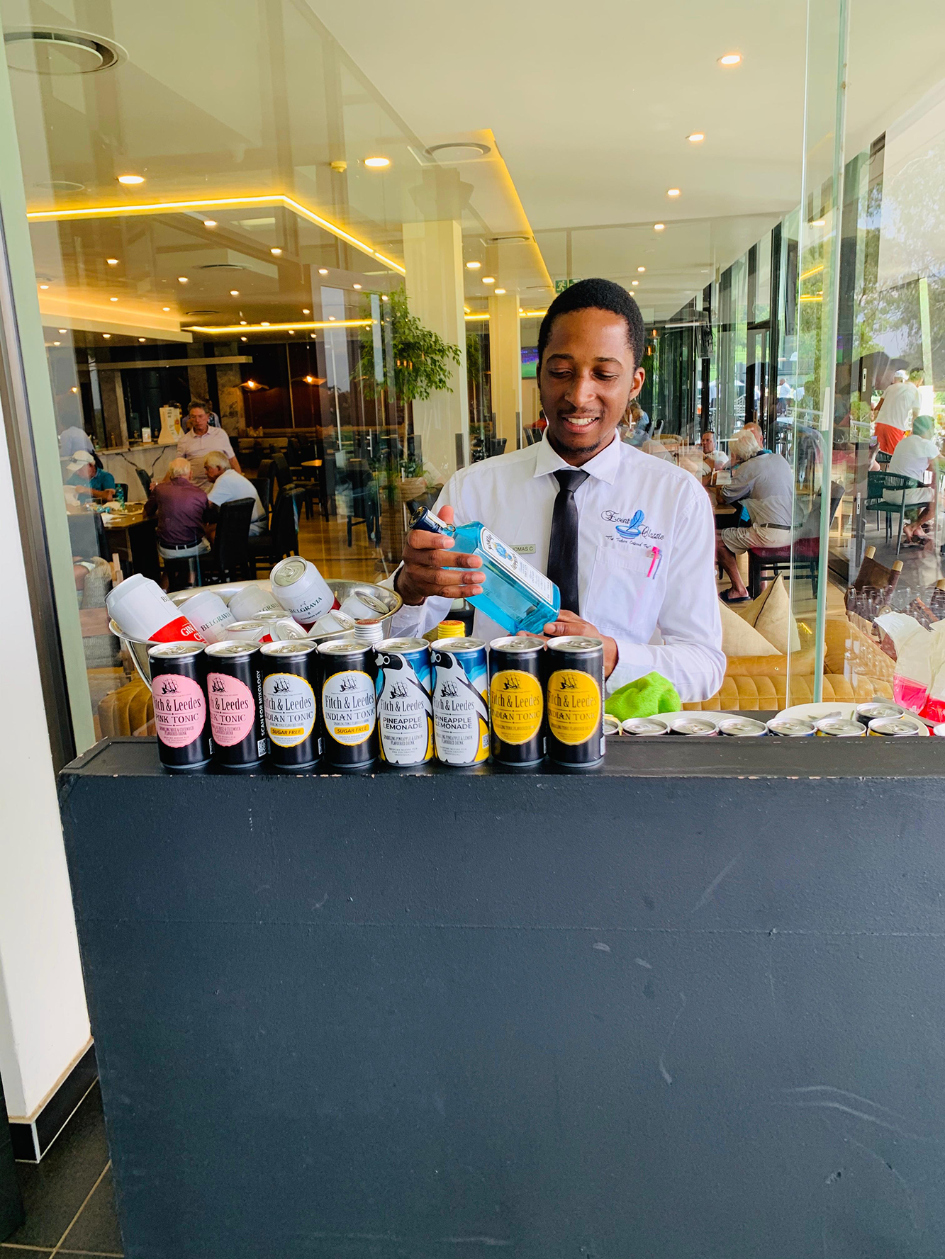 Bartender serving drinks at a mobile bar setup