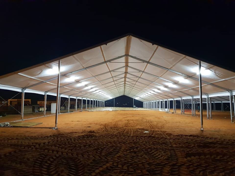Large event marquee structure with lights inside