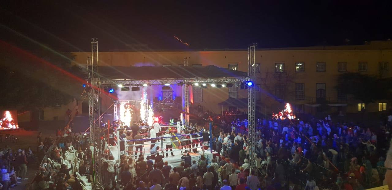 Uplighting setup at an outdoor boxing event
