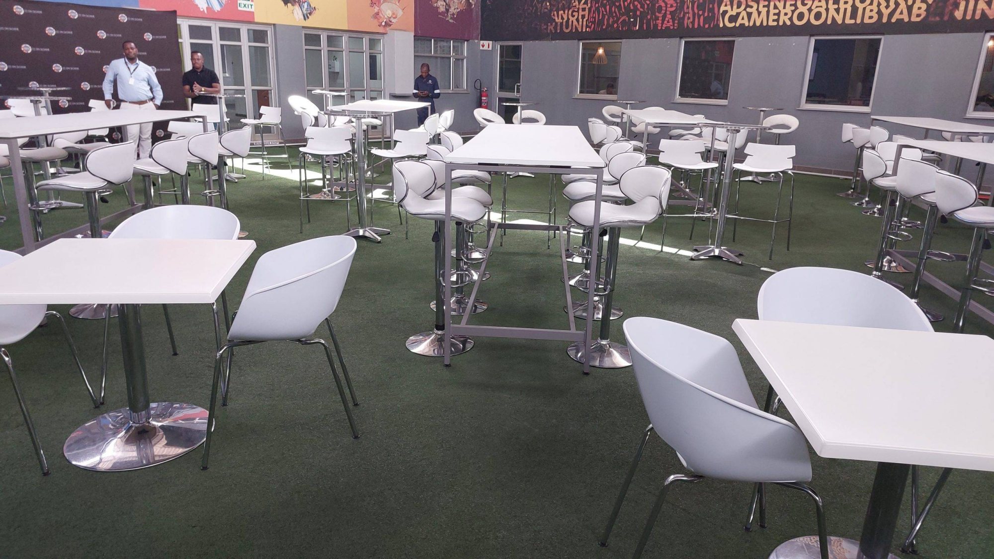 Cocktail tables and chairs arranged in a lounge area