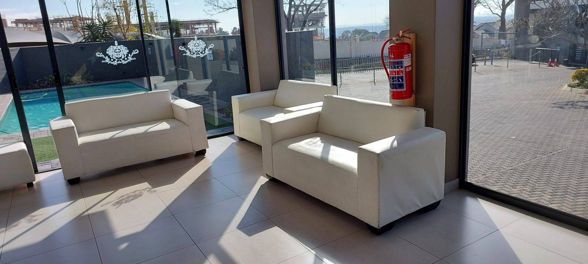 White lounge chairs in a bright event space