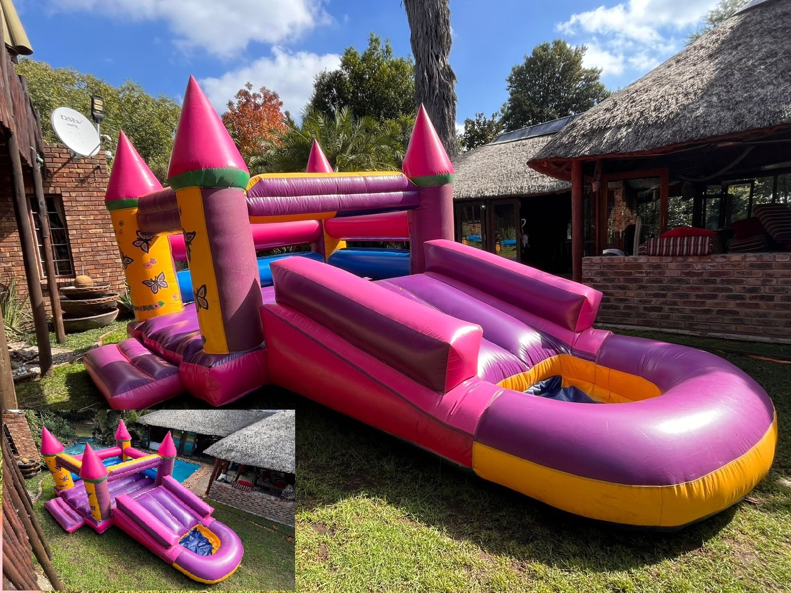 A pink and yellow jumping castle with slide on green grass