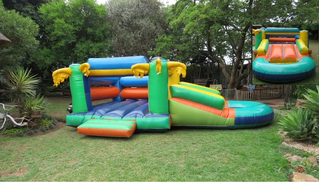 Colorful inflatable slide combo set up outdoors