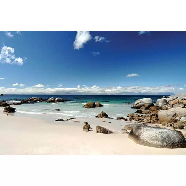 Scenic view of a beach with rocks and clear blue water