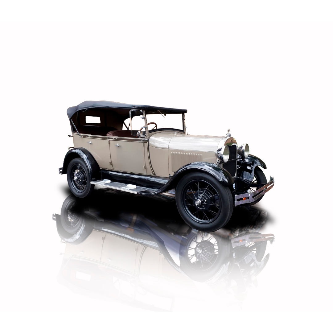 Vintage car with black and cream exterior, parked elegantly