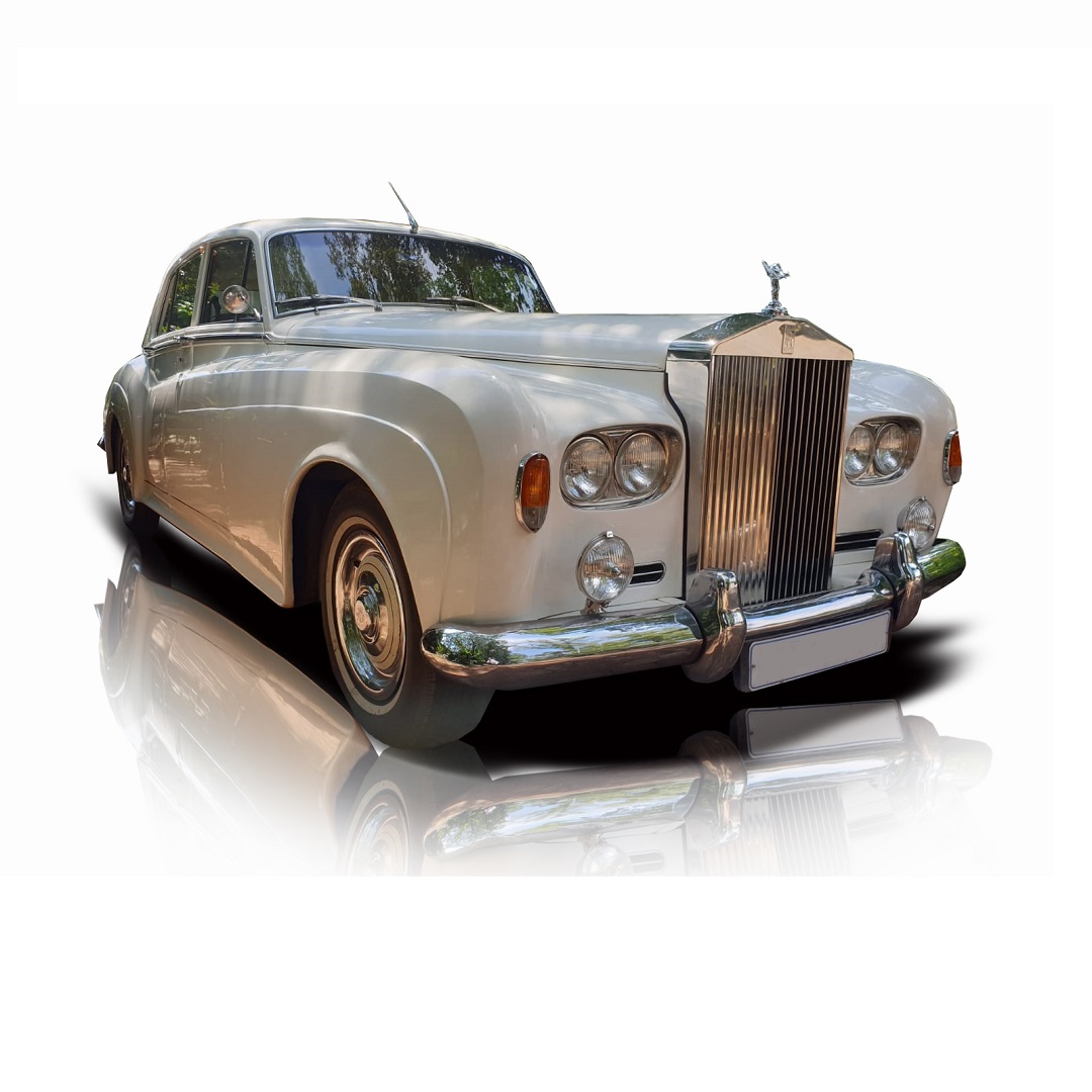 A classic Rolls Royce with a polished finish.