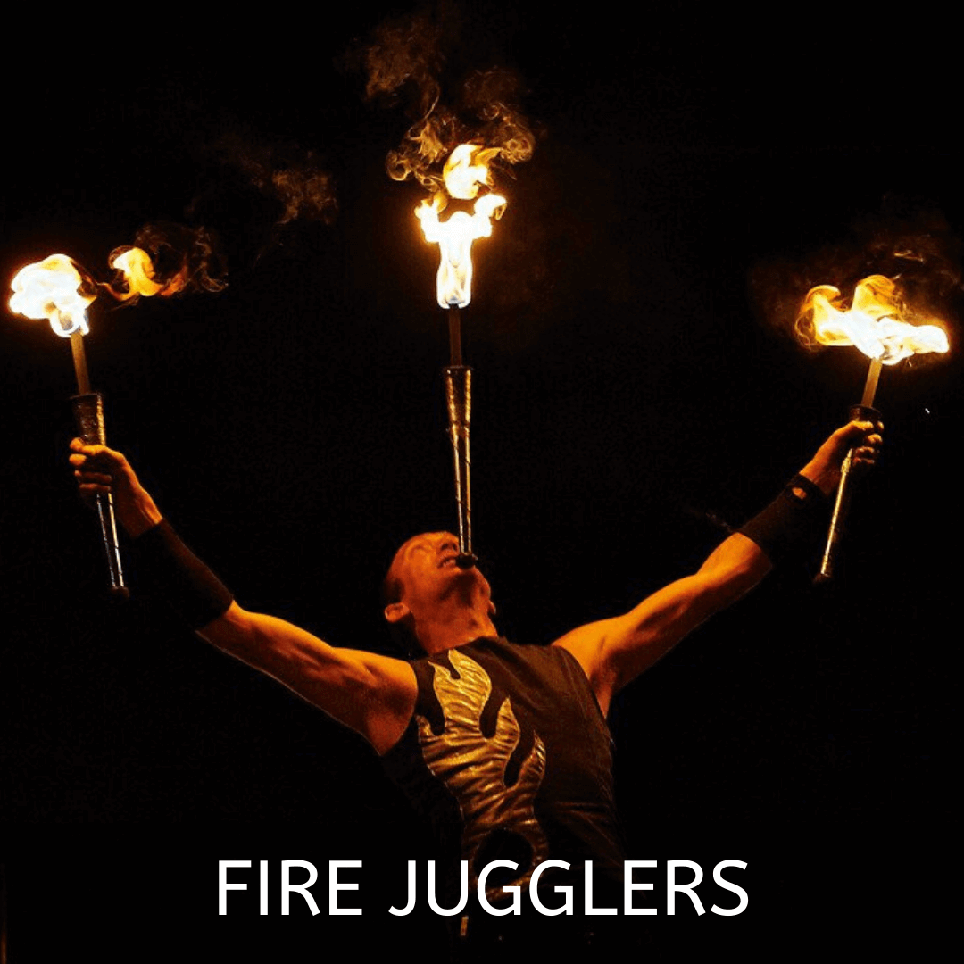 Fire juggler performing with flaming torches