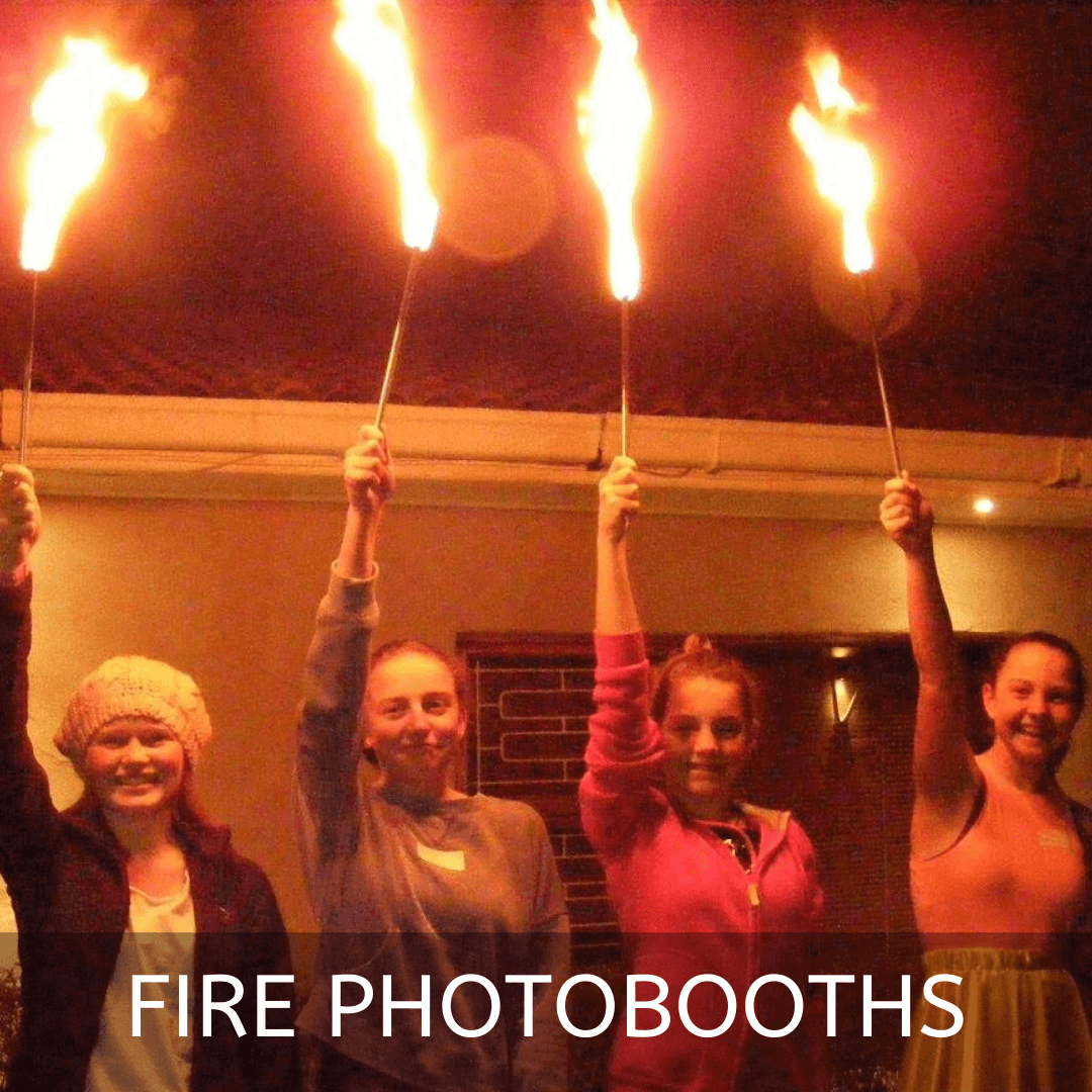 Group of people holding fire torches at a photobooth